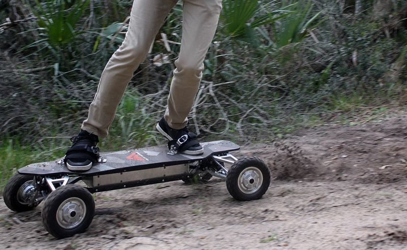 riding e skateboard in mountains