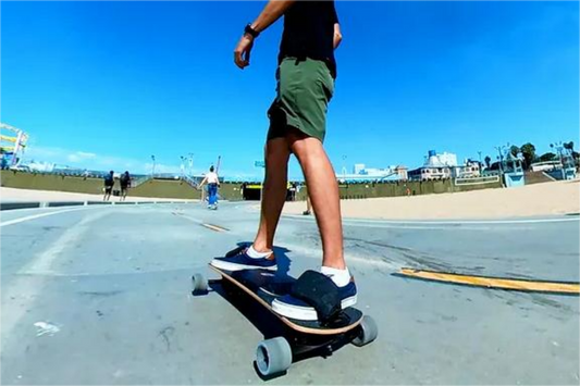 ride a motorized longboard