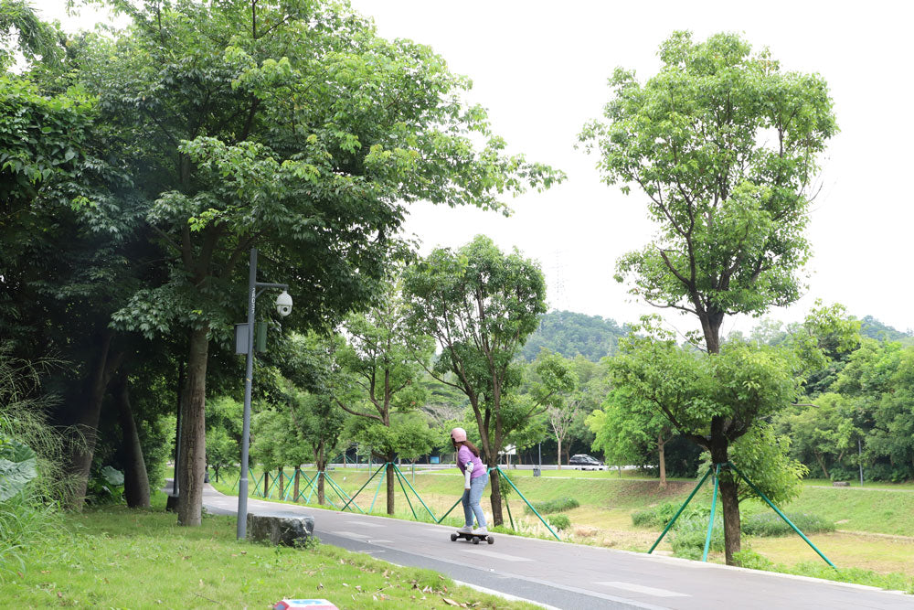 riding a veymax e-skateboard