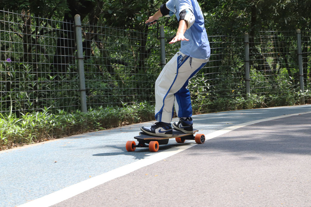 riding veymax electric longboards